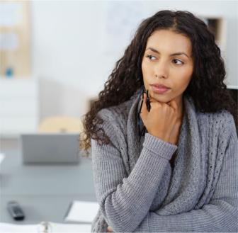 Woman considering health plan options.